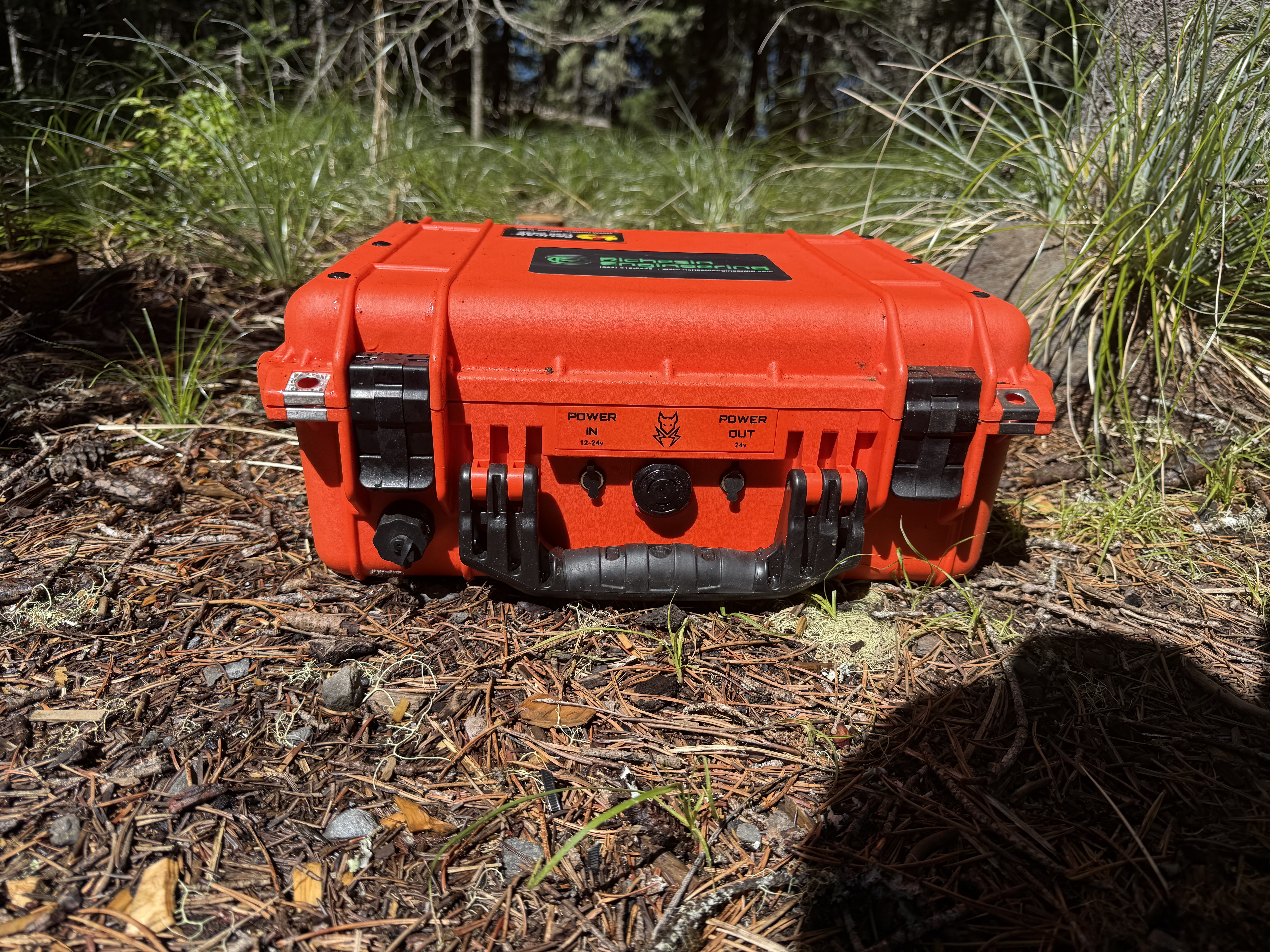 Starlink Mini satellite internet kit inside IP65-rated Pelican case with integrated LiFePO4 battery, ready for wildland fire incident deployment in remote Pacific Northwest terrain